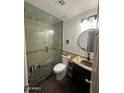 Updated bathroom with a glass shower, granite vanity, and modern fixtures at 2171 N Santiana Pl, Casa Grande, AZ 85122