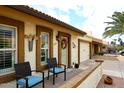 Front view of a light brown stucco house with a two-car garage at 2329 N Recker Rd # 23, Mesa, AZ 85215