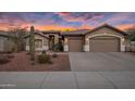 Two-car garage and front entry of this charming one-story home with desert landscaping at 26803 N 45Th Pl, Cave Creek, AZ 85331