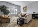 Light and airy living room featuring hardwood floors and comfortable seating at 26803 N 45Th Pl, Cave Creek, AZ 85331