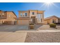 Attractive two-story home featuring a two-car garage, stone veneer accents, and mature landscaping at 3091 E Morenci Rd, San Tan Valley, AZ 85143
