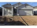 Charming single-story home featuring a two-car garage and a well-manicured lawn at 4178 E Kolin Ln, San Tan Valley, AZ 85143