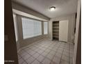 Bright dining area with large window and built-in shelving at 8520 W Palm Ln # 1021, Phoenix, AZ 85037