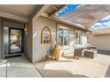 Covered patio with seating area, creating an inviting outdoor space at 949 S 79Th Way, Mesa, AZ 85208