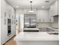 Bright kitchen with stainless steel appliances, large island, and modern cabinetry at 10041 N 52Nd Pl, Paradise Valley, AZ 85253