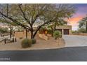 Lovely desert home with stucco exterior, two-car garage, and mature trees at 1300 Coyote Pass --, Carefree, AZ 85377