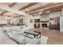 Spacious living room with wood beam ceiling, stone fireplace, and built-ins at 1300 Coyote Pass --, Carefree, AZ 85377