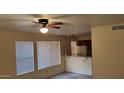 Bright living room with neutral carpeting and sliding glass door at 1432 W Emerald Ave # 647, Mesa, AZ 85202