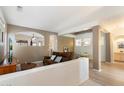 Spacious living room with hardwood floors and a half wall partition at 15636 E Yucca Dr, Fountain Hills, AZ 85268