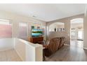 Living room features hardwood floors and a large flat-screen TV at 15636 E Yucca Dr, Fountain Hills, AZ 85268