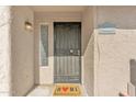 Close up of front door with security gate, welcome mat, and unit number for added security at 2533 W Hazelwood St # 3, Phoenix, AZ 85017