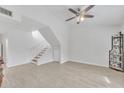 Bright, airy living room featuring tile floors, high ceilings, and staircase to the second level at 2533 W Hazelwood St # 3, Phoenix, AZ 85017