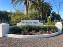Beekman Place entrance with landscaped flower bed at 2631 E Beekman Pl, Phoenix, AZ 85016