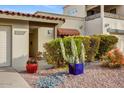 House exterior featuring drought-tolerant landscaping and a covered entryway at 2631 E Beekman Pl, Phoenix, AZ 85016