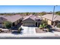 Beautiful single-Gathering home boasts a well-manicured yard and a spacious three-car garage at 514 S 224Th Dr, Buckeye, AZ 85326