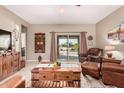 Spacious living area with sliding glass doors to backyard at 514 S 224Th Dr, Buckeye, AZ 85326