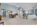 Open concept dining room with a chandelier and adjacent living room at 900 Cacti Verde --, Wickenburg, AZ 85390