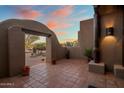 Inviting courtyard entry with tile flooring and desert landscaping at 9950 E Sundance Trl, Scottsdale, AZ 85262