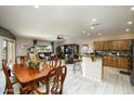 Open concept kitchen and dining area with wood cabinets and granite countertops at 11250 E Kilarea Ave # 245, Mesa, AZ 85209
