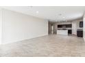 Spacious living room with tile flooring and an open floor plan at 1791 W Sombra Ave, Apache Junction, AZ 85120