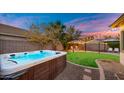 Relax in this luxurious hot tub, nestled in a beautifully landscaped backyard at 21752 E Estrella Rd, Queen Creek, AZ 85142