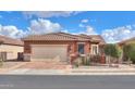 House exterior showcasing a two-car garage and well-maintained landscaping at 22 S Mesilla Ln, Casa Grande, AZ 85194