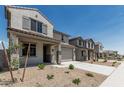 Inviting two-story home with a two-car garage, covered entry, and easy-care landscaping at 22831 N 183Rd Dr, Surprise, AZ 85387