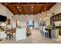 Spacious living room with high ceilings, a stone fireplace, and ample natural light at 27256 N 97Th Pl, Scottsdale, AZ 85262
