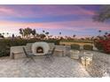 Relaxing backyard oasis with a fire pit and seating area, perfect for entertaining at 3171 N 159Th Ave, Goodyear, AZ 85395