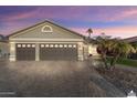 Beautiful two-car garage home with a large driveway and mature landscaping at 3171 N 159Th Ave, Goodyear, AZ 85395