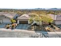 Single-story home with mountain views and desert landscaping at 41933 N Crooked Stick Rd, Anthem, AZ 85086