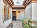 Front courtyard with stone flooring and potted plants at 41933 N Crooked Stick Rd, Anthem, AZ 85086