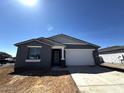 Charming single-story home featuring a two-car garage and a low-maintenance landscaped front yard at 4353 E Bradford Ave, San Tan Valley, AZ 85140
