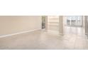 Bright living room with tile floors and built-in shelving at 5102 N 31St Pl # 422, Phoenix, AZ 85016