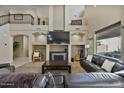 Living room with fireplace and built-in shelving at 9348 E Grandview St, Mesa, AZ 85207