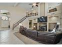 Spacious living room with a fireplace and high ceilings at 9348 E Grandview St, Mesa, AZ 85207