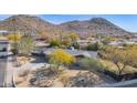 Aerial view of a house with a driveway and mature trees at 9843 N 5Th Ave, Phoenix, AZ 85021