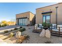 Stunning desert landscaping enhances this contemporary home's curb appeal at 12451 E Troon Vista Dr, Scottsdale, AZ 85255