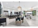 Open-concept kitchen with modern cabinetry, island, and breakfast area at 12451 E Troon Vista Dr, Scottsdale, AZ 85255