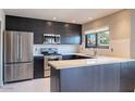 Modern kitchen with stainless steel appliances and ample counter space at 14637 N Olympic Way, Fountain Hills, AZ 85268