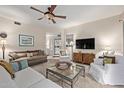 Bright and airy living room featuring comfy furniture and a TV at 15225 N 100Th St # 1208, Scottsdale, AZ 85260