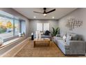 Bright living room with a cozy seating area and large window at 1743 W Butler Dr, Phoenix, AZ 85021