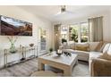 Bright living room featuring neutral decor, plush seating, and lots of light from the large windows at 20100 N 78Th Pl # 1040, Scottsdale, AZ 85255