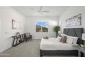 Serene main bedroom featuring a large bed, neutral decor, and bright natural light at 2027 W Sleepy Ranch Rd, Phoenix, AZ 85085