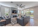 Spacious living room with fireplace and sliding doors leading to backyard at 22633 E Domingo Rd, Queen Creek, AZ 85142