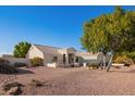 Front view of house showcasing desert landscaping at 23204 N Paseo Laredo Ln, Peoria, AZ 85383