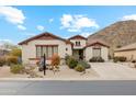 Single-story home with desert landscaping and mountain backdrop at 31538 N Larkspur Dr, San Tan Valley, AZ 85143