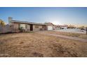 House with a walkway to the entrance and a grassy front yard at 8923 W Campbell Ave, Phoenix, AZ 85037