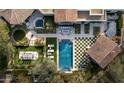 Aerial view showcasing the expansive backyard, pool, and home layout at 9290 E Thompson Peak Pkwy # 422, Scottsdale, AZ 85255