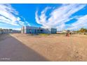 Property view showcasing a large lot and a modern home design at 10226 N 171St Dr, Waddell, AZ 85355